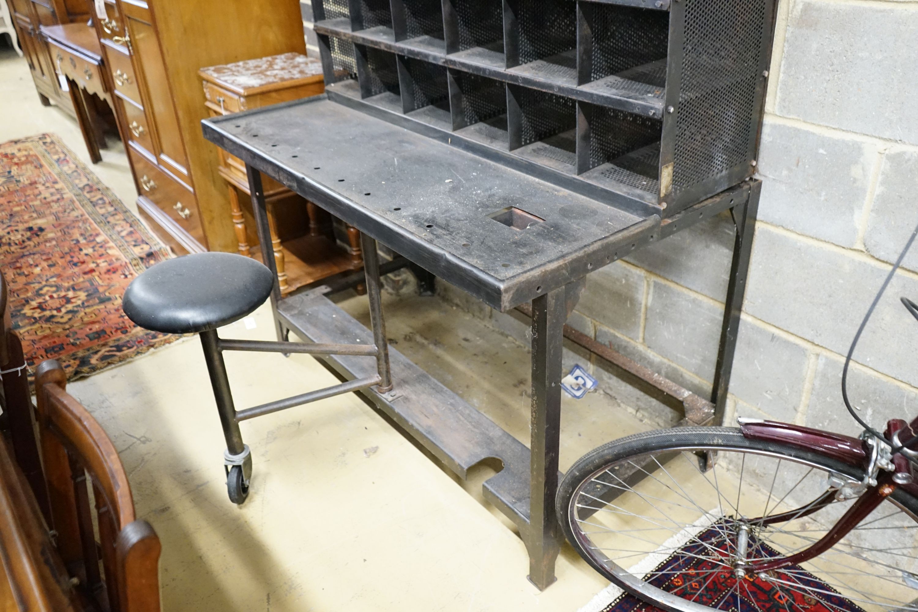 A Royal Mail metal mail sorting unit with integral seat, width 127cm, depth 71cm, height 190cm